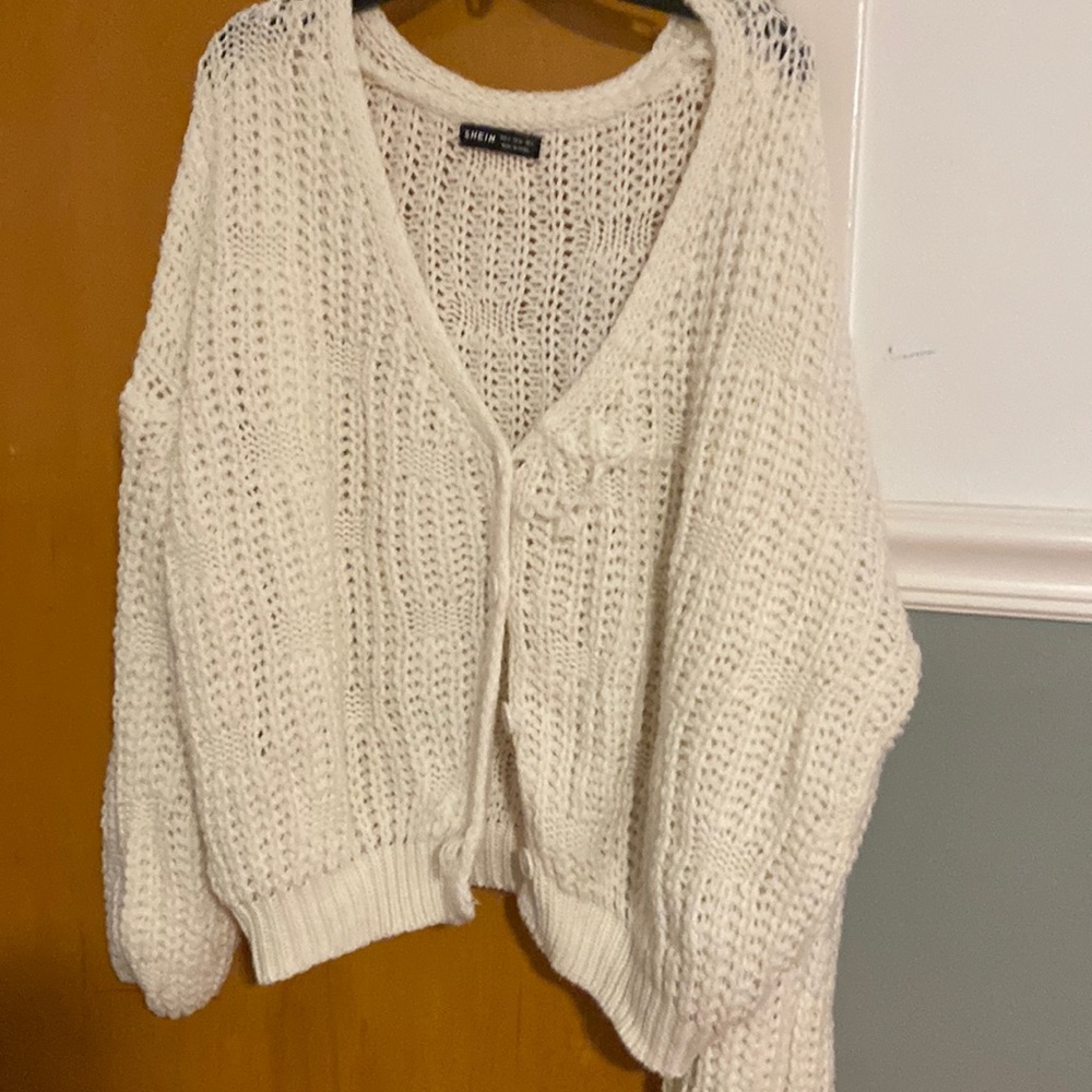 cream/white sweater, new good condition except for a snag